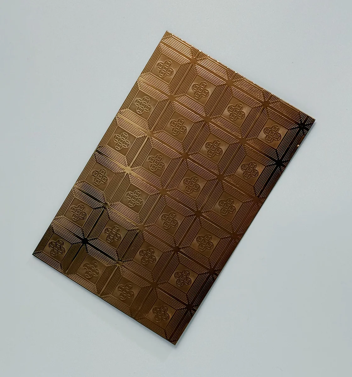 Item B04 — 304 Anti-Fingerprint 8K Five-Blessing Coin Pattern Rose Gold Stainless Steel Sheet sample.