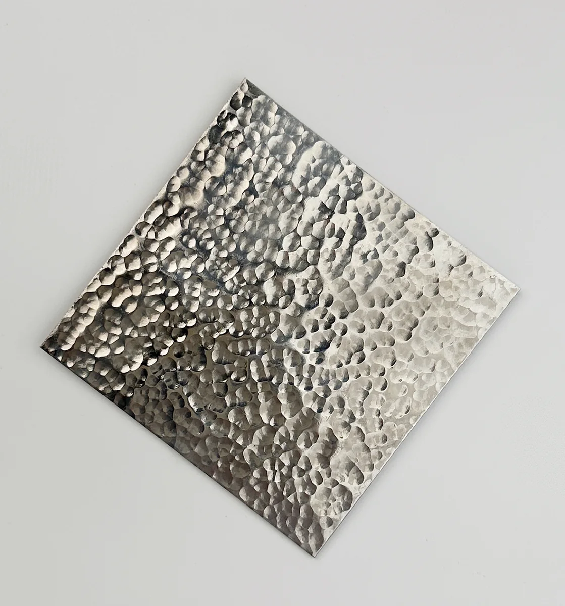 Item D05 — 304 6K Hammered Texture Stainless Steel Sheet sample.