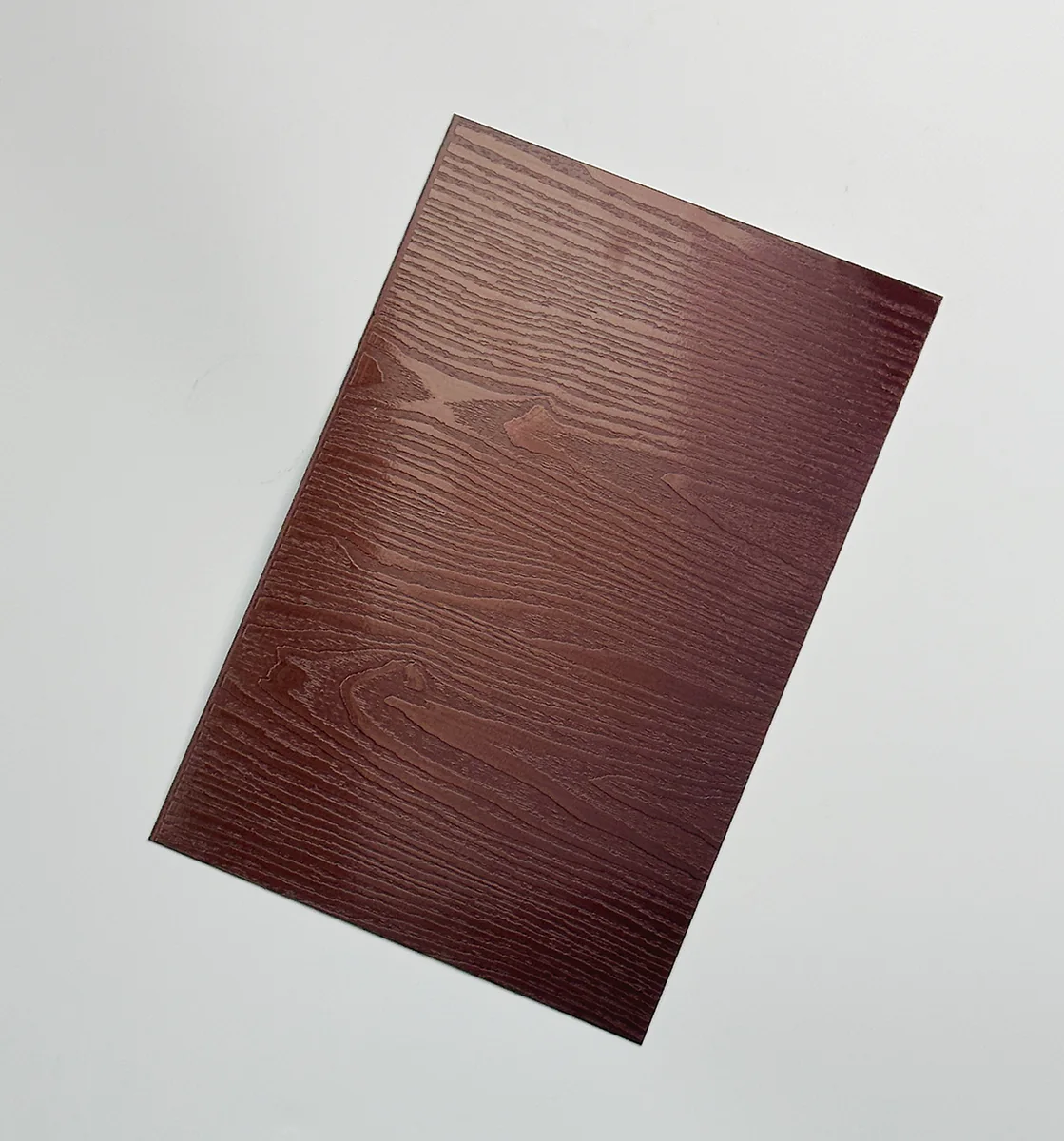 Item D37 — 304 Royal Sandalwood Rose Red Wood Grain Stainless Steel Sheet sample.