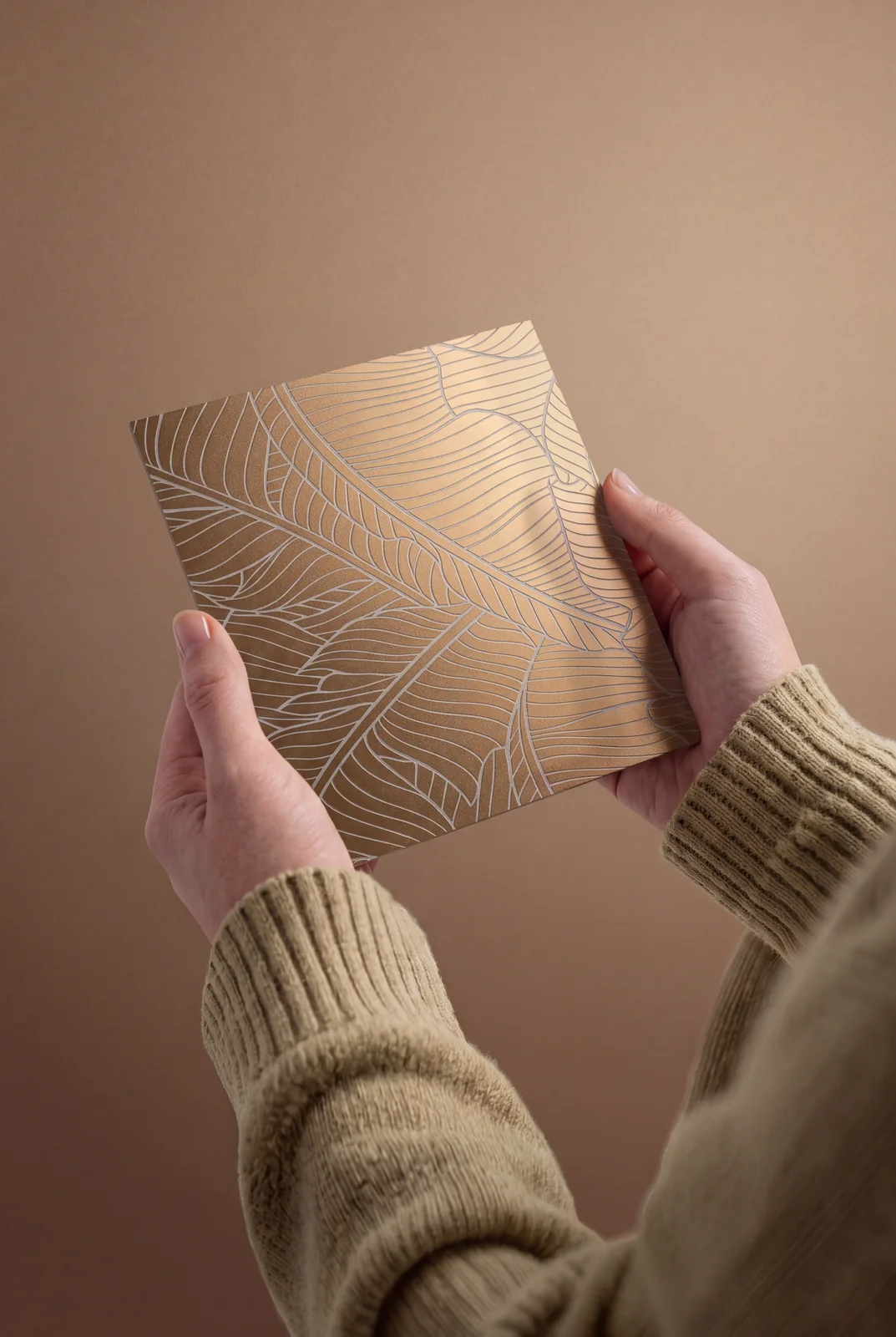 Hand-held gold leaf etched decorative stainless steel sample