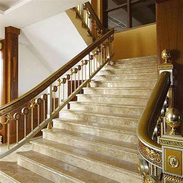 Decorative metal stair railing in a finished interior